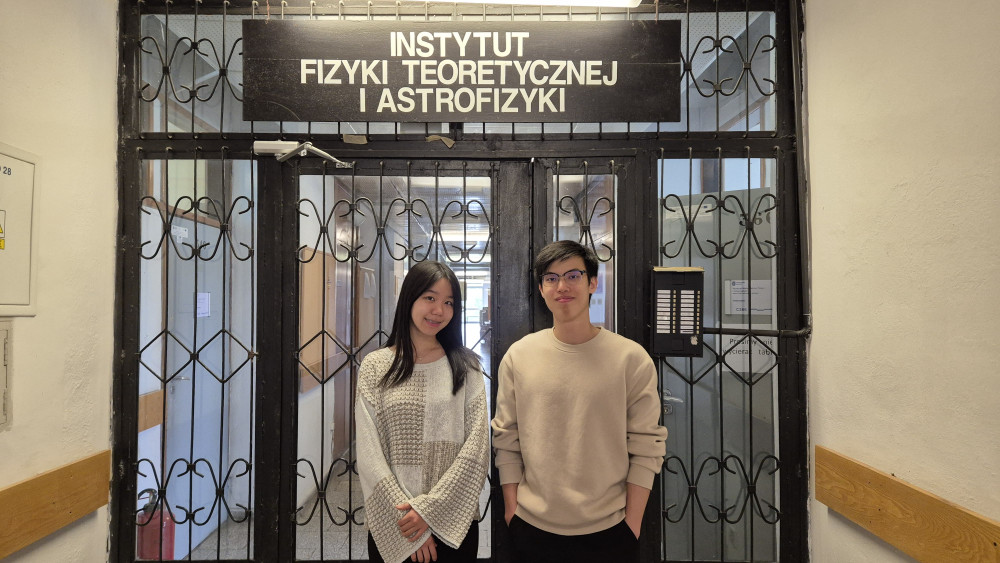 two interns in front of the door in the corridor