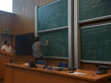 student by the board during tutorial