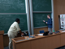 student by the board during tutorial
