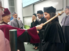 The Vice-Rector hands the diploma to Dr Chithra Raj